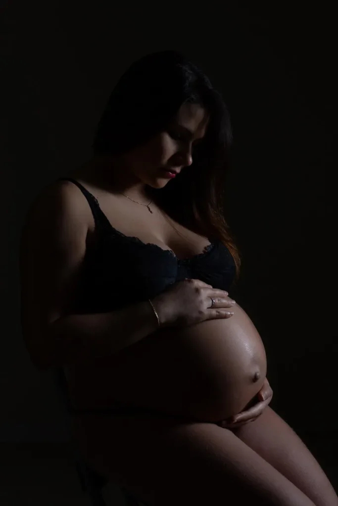 a pregnant woman in a black garment