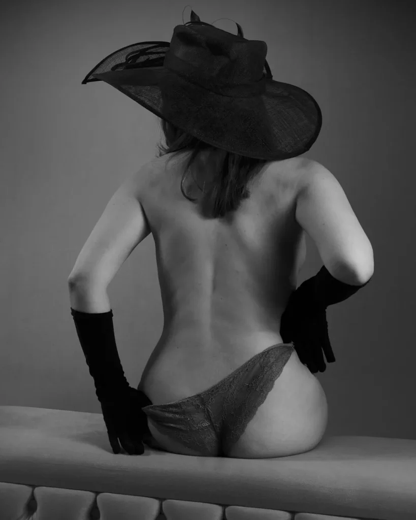 a woman wearing a hat and underwear